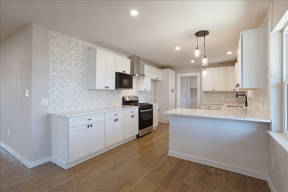 Single-room kitchen remodel with white shaker cabinets