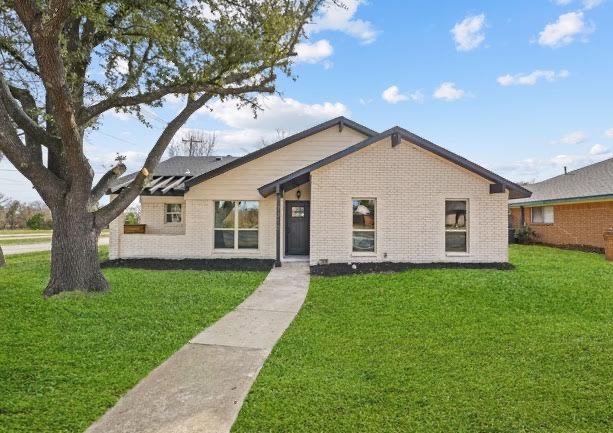 Painted brick home with new front door