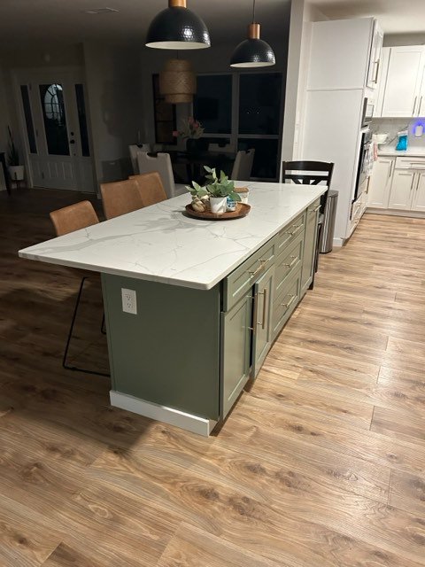 Sage green island with marble-look quartz